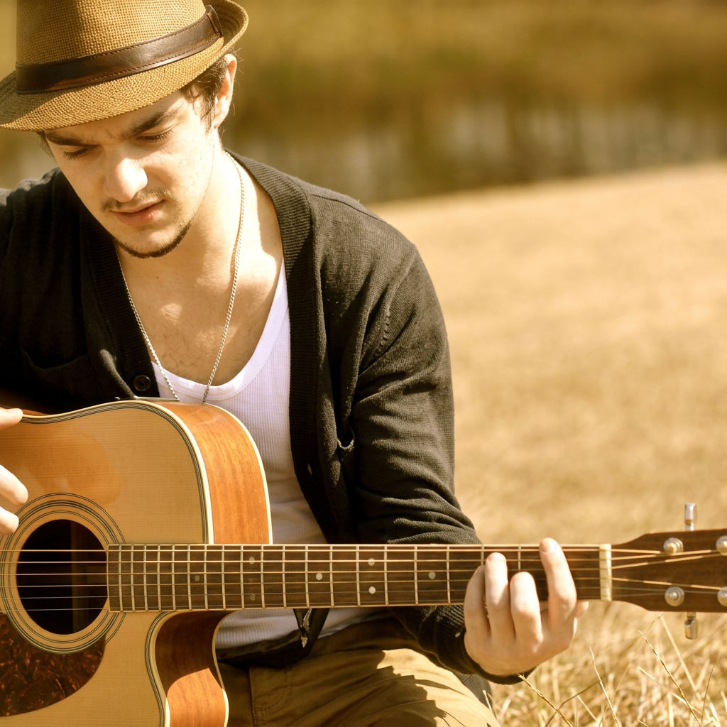 Carl Martin playing acoustic guitar outdoors